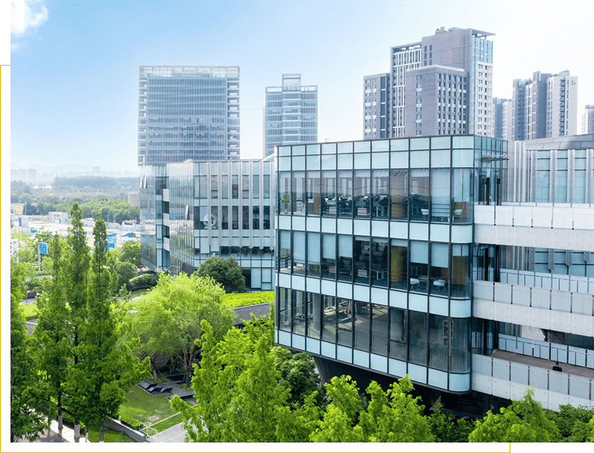 Modern office buildings with green surroundings.