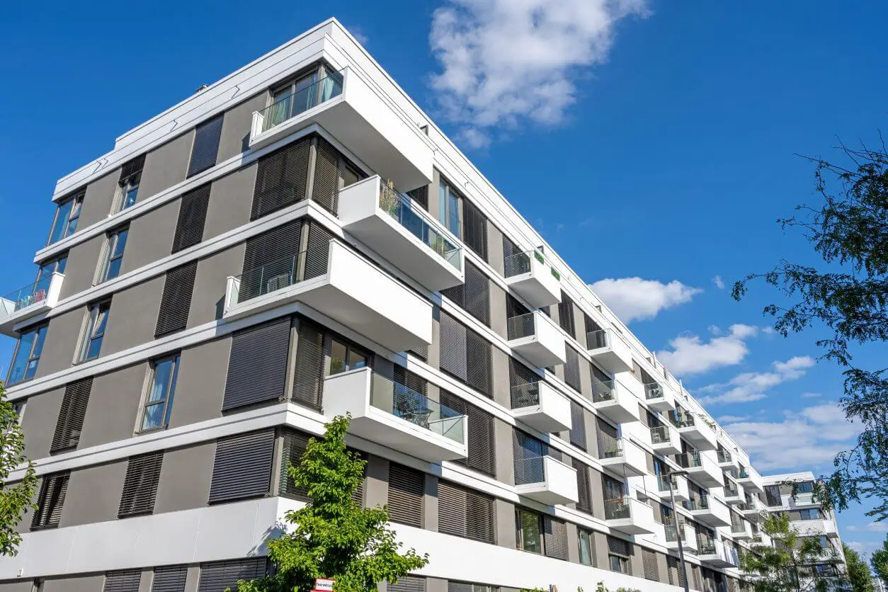 Modern apartment building under blue sky.