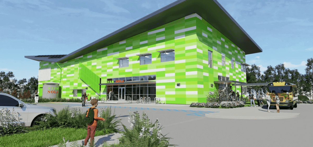 A vibrant green and white building with large glass entrance doors.
